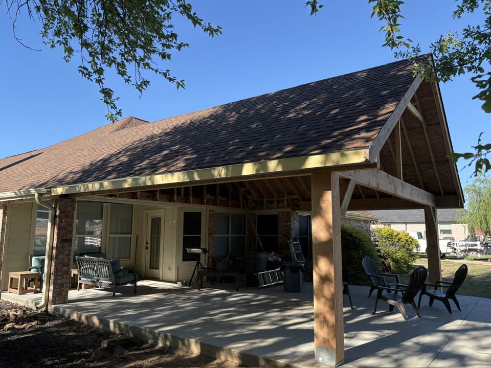 Raw unstained gable patio cover — side angle during construction